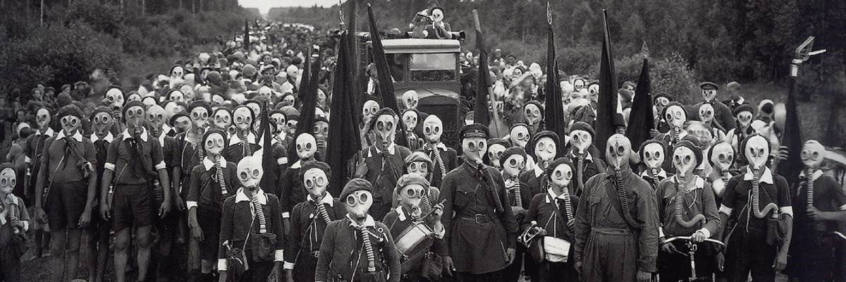 In 1937, members of the USSR's Young Pioneers Defense , organized to protect the Motherland, pose in gas masks to support their slogan, "Always Prepared!"
