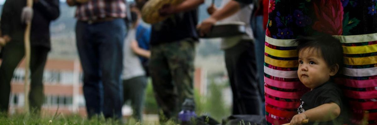 Indigenous people gather at the site of Kamloops Indian Residential School.
