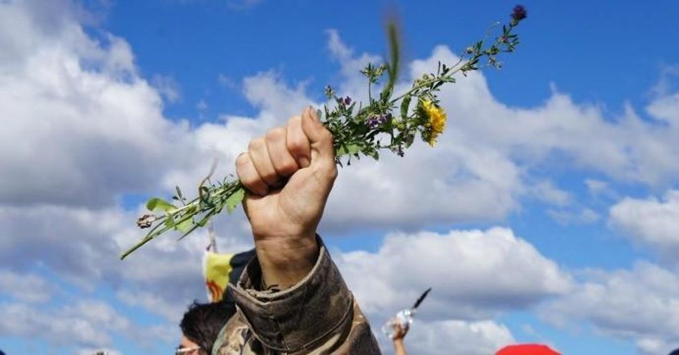 Indigenous women lead a direct action at Standing Rock, North Dakota. (Credit: Emily Arasim/WECAN)