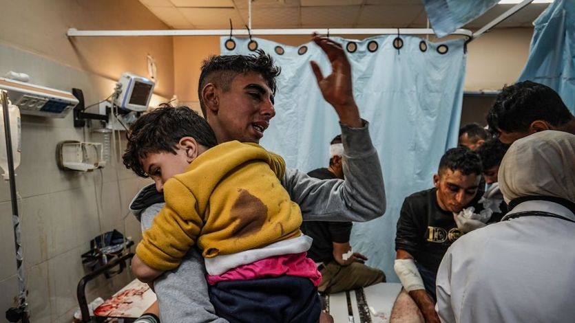  Injured Palestinians are brought to a hospital following Israeli attacks