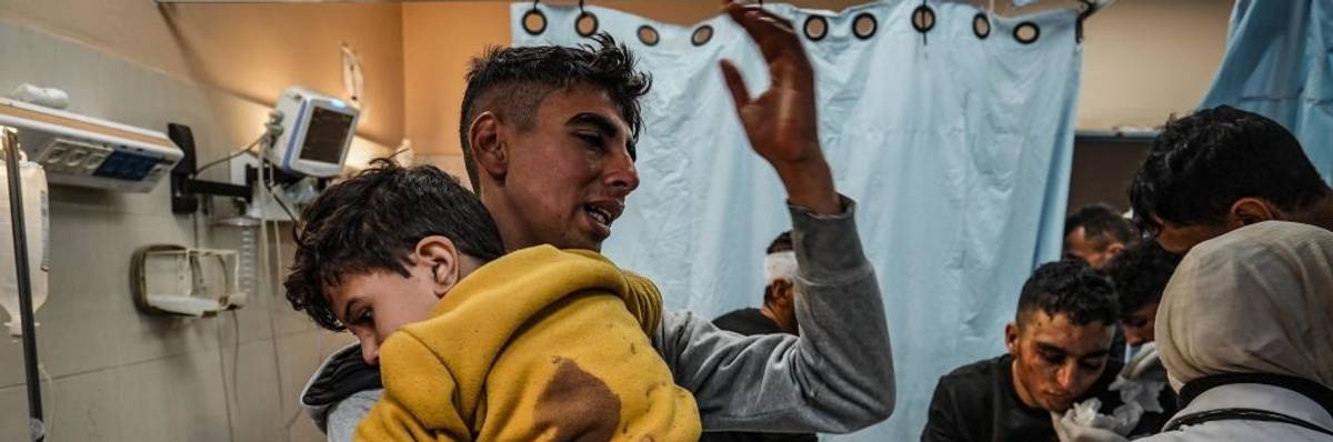 Injured Palestinians are brought to a hospital following Israeli attacks