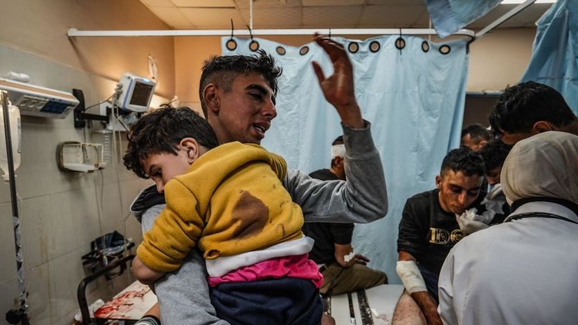 Injured Palestinians are brought to a hospital following Israeli attacks