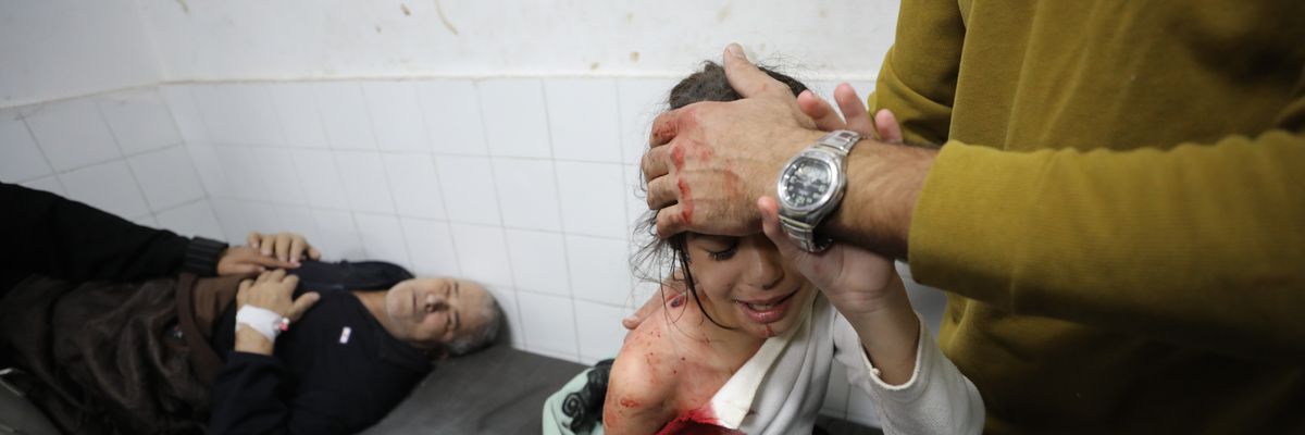 Injured Palestinians, including children, are brought to Al Ahli Baptist Hospital