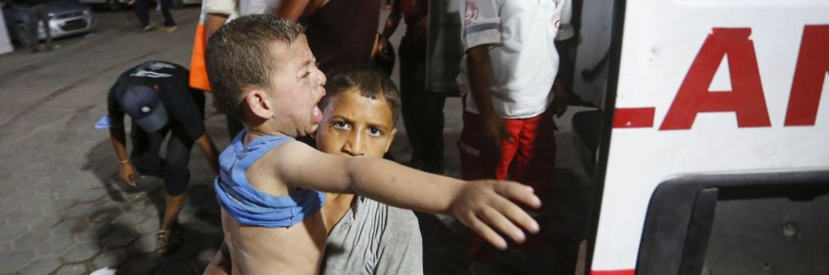 Injured Palestinians, including children, are brought to Al-Aqsa Martyrs Hospital