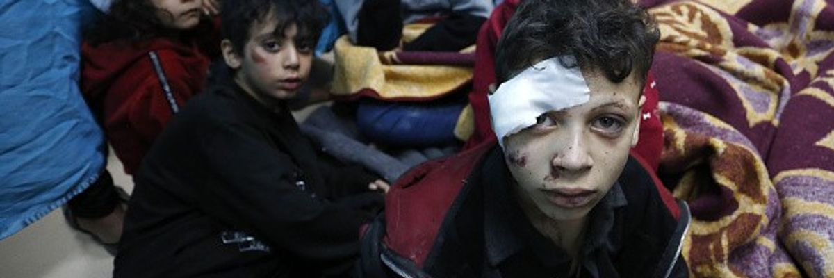 Injured Palestinians, including children, are taken to Al-Aqsa Martyrs Hospital