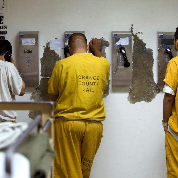 Inmates make collect phone calls at a jail in Santa Ana, California on May 24, 2011.