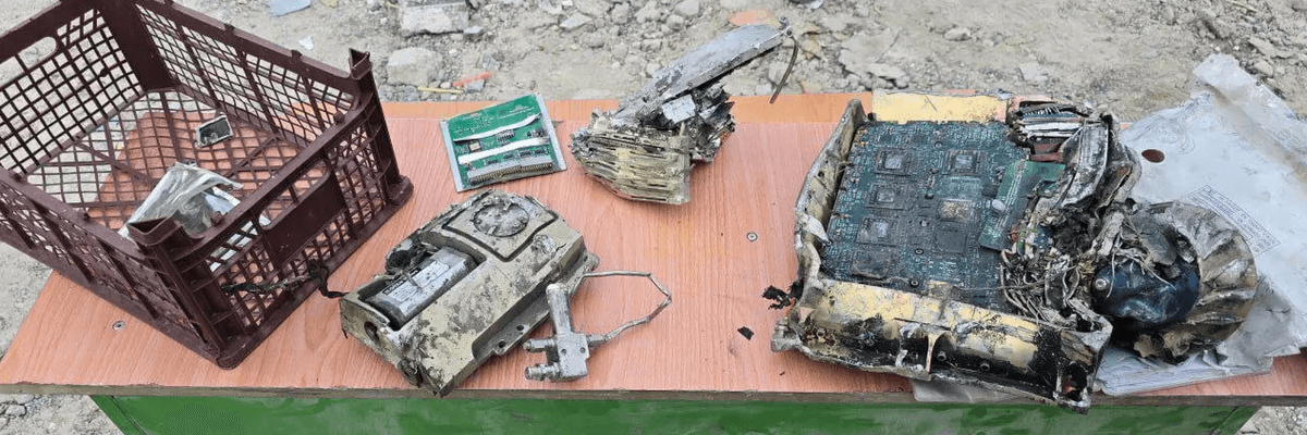 Iranian officials display missile fragments with US markings