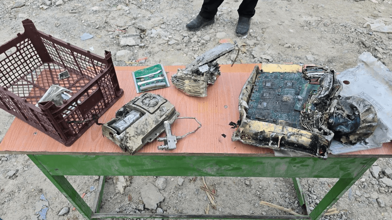 Iranian officials display missile fragments with US markings
