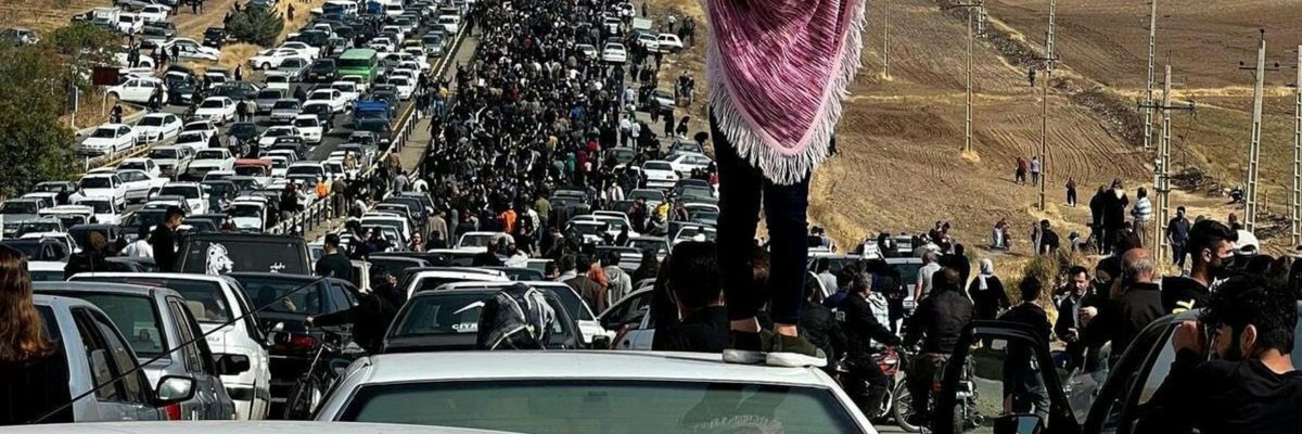 Iranian woman protesting 