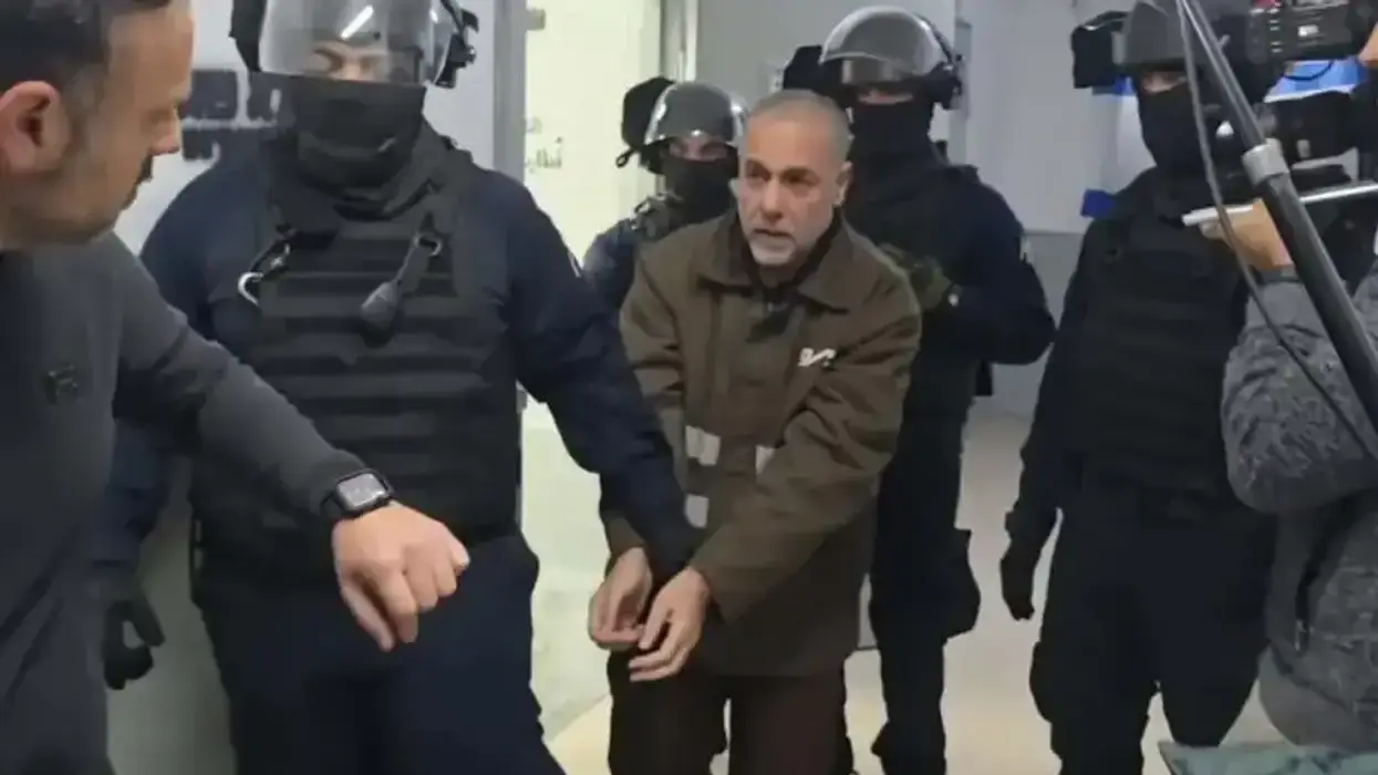 Israeli forces in black move Dr. Hussam Abu Safiya