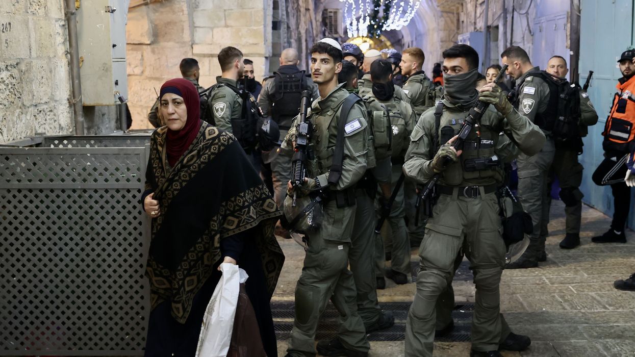 Israeli police officers force Palestinian worshipers to leave the Al-Aqsa Mosque compound in occupied East Jerusalem on April 5, 2023.