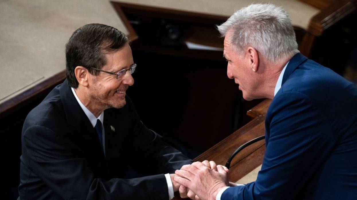 Israeli President Isaac Herzog and U.S. House Speaker Kevin McCarthy shake hands.