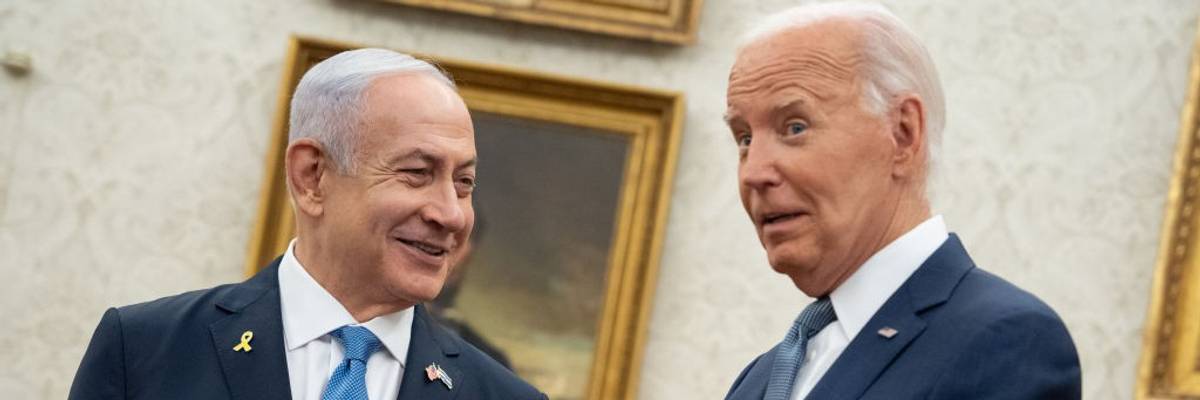 Israeli Prime Minister Benjamin Netanyahu and U.S. President Joe Biden smile during a meeting