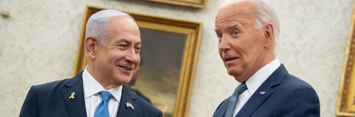 Israeli Prime Minister Benjamin Netanyahu and U.S. President Joe Biden smile during a meeting