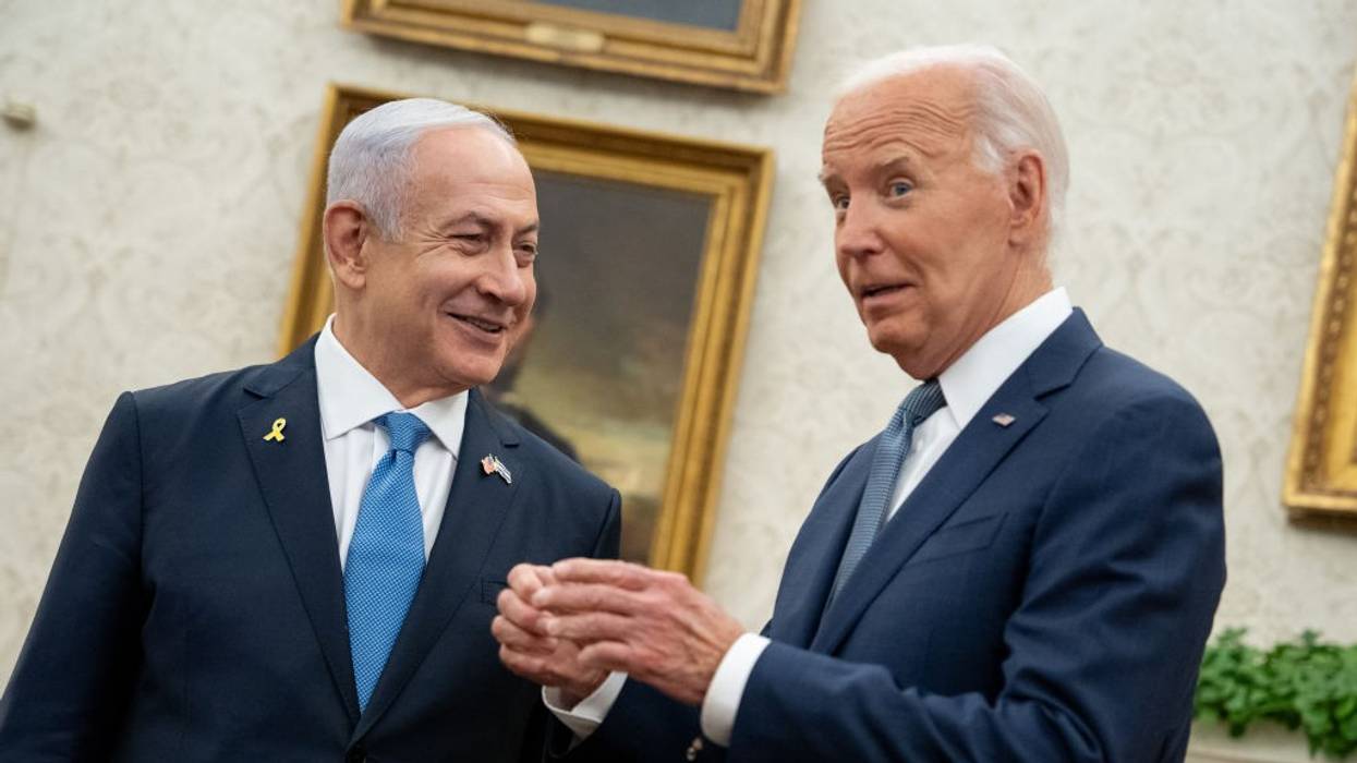 Israeli Prime Minister Benjamin Netanyahu and U.S. President Joe Biden smile during a meeting