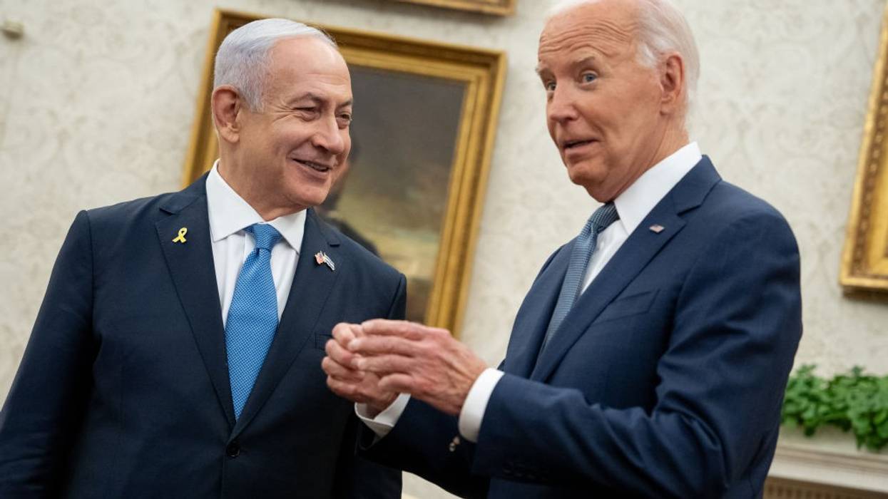 Israeli Prime Minister Benjamin Netanyahu and U.S. President Joe Biden smile during a meeting