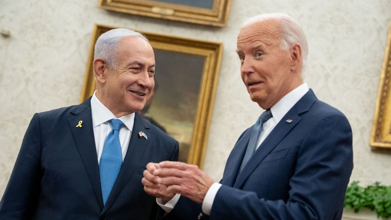Israeli Prime Minister Benjamin Netanyahu and U.S. President Joe Biden smile during a meeting