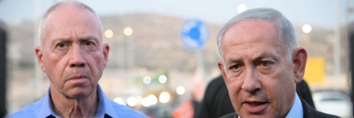 Israeli Prime Minister Benjamin Netanyahu (R) and Israeli Defense Minister Yoav Gallant (L) stand side by side.