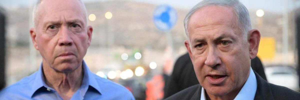 Israeli Prime Minister Benjamin Netanyahu (R) and Israeli Defense Minister Yoav Gallant (L) stand side by side.