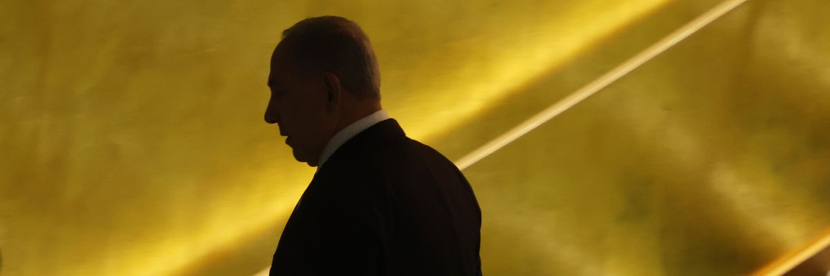 Israeli Prime Minister Benjamin Netanyahu turns away from the camera. 