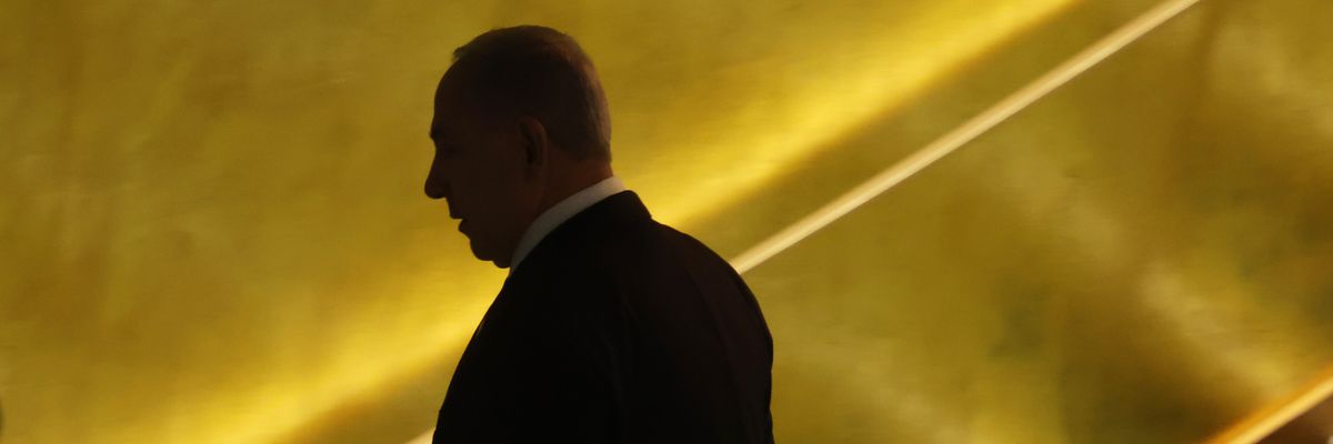 Israeli Prime Minister Benjamin Netanyahu turns away from the camera.