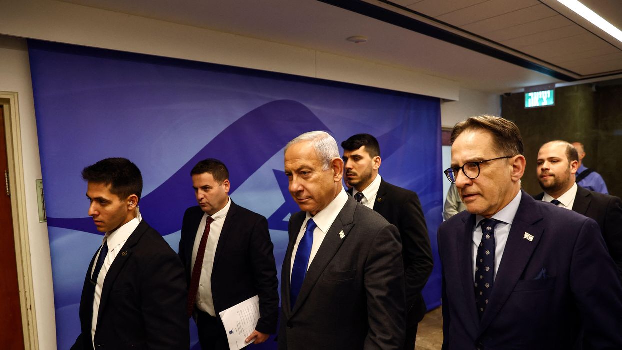 Israeli Prime Minister Benjamin Netanyahu walks to a cabinet meeting