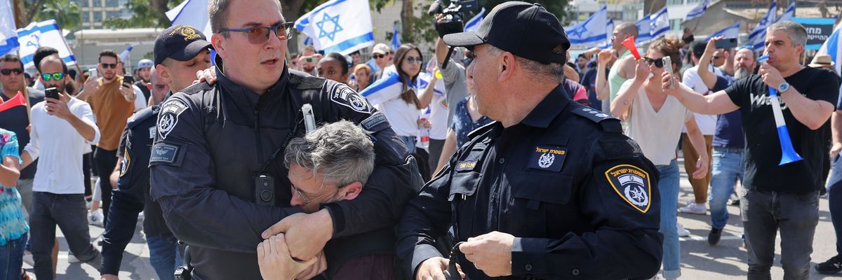 Israeli security forces detain a protester