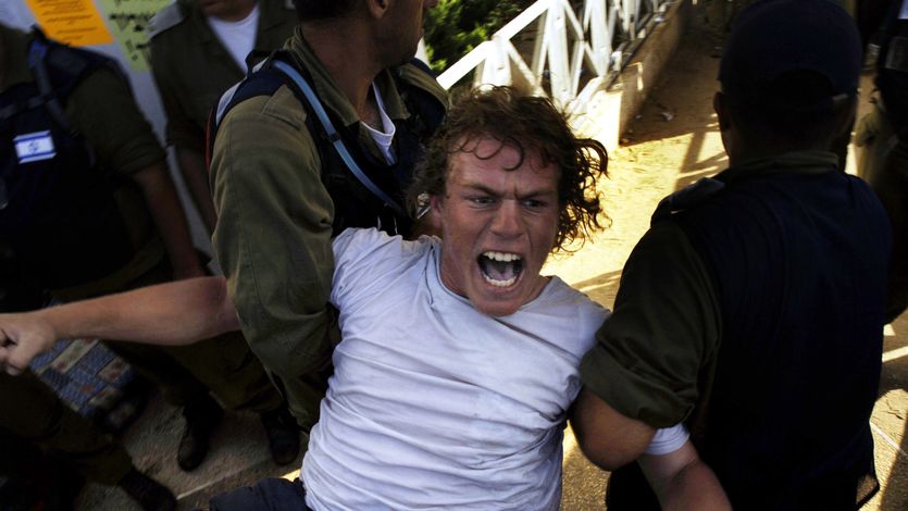 Israeli settle being dragged out of Gaza in 2005.