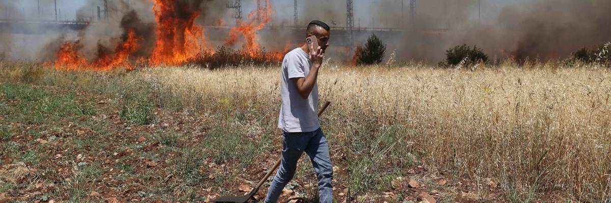 Israeli settlers set fire to Palestinians' agricultural fields in the West Bank