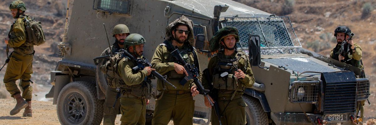 Israeli soldiers and armored vehicles