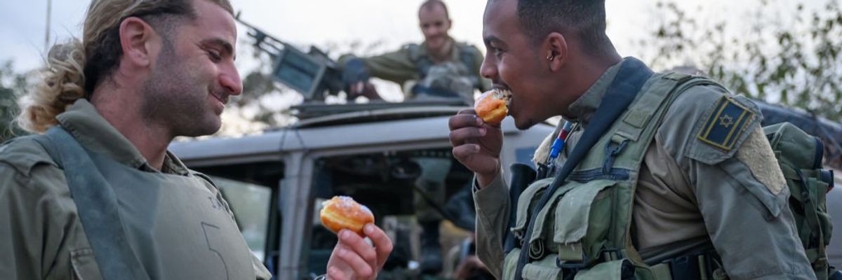 Israeli soldiers eat jelly doughnuts