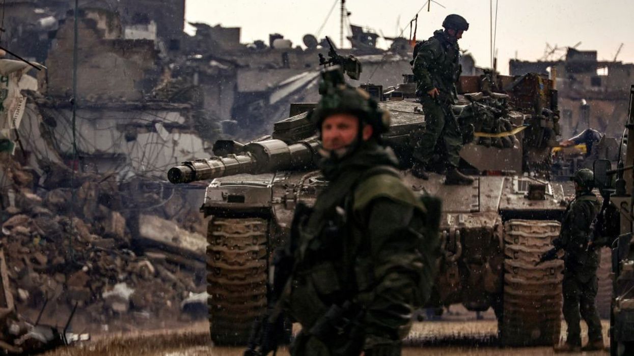 Israeli troops and a tank in Gaza