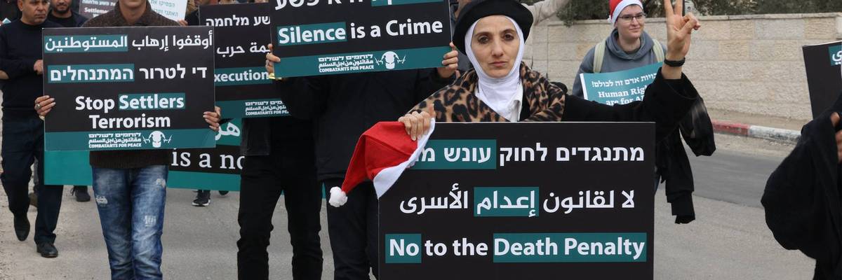Israelis, Palestinians, and other people march in Bethlehem against the proposed Israeli death penalty bill