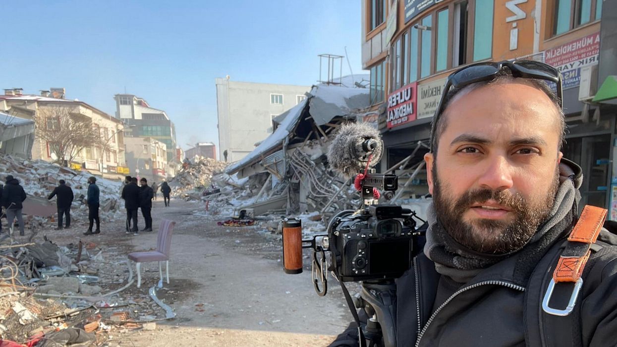 Issam Abdallah with his camera in the aftermath of the