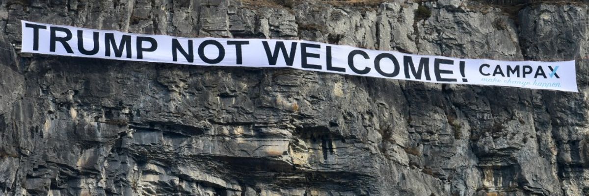 'Trump Not Welcome': Swiss Group Drops 60-Meter Mountaintop Banner Near Davos