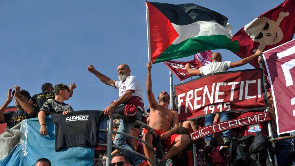 Italian football fans wave a Palestinian flag