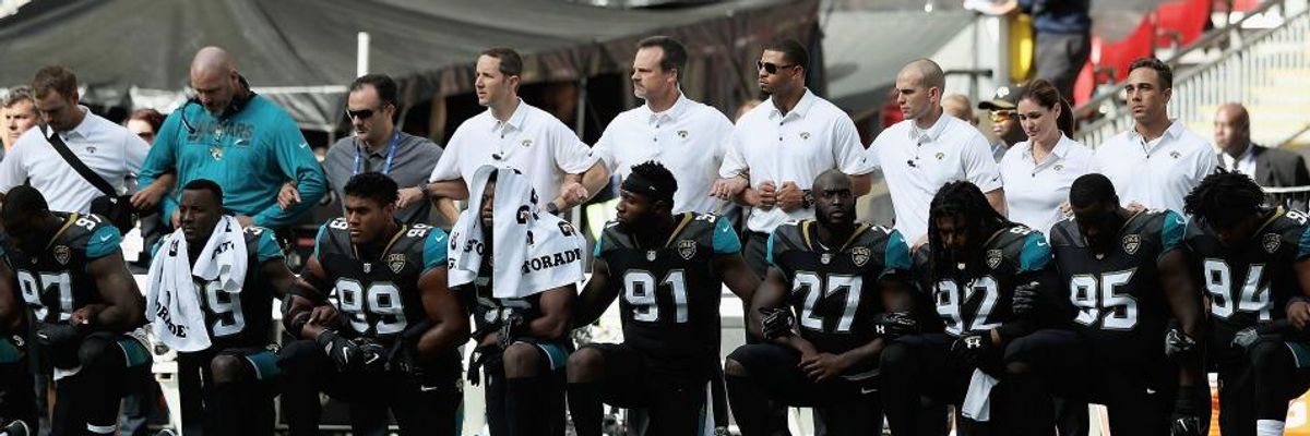 Jacksonville Jaguar players take a knee