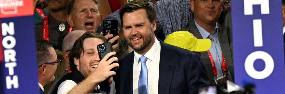 James Vance poses for a selfie with a supporter at the RNC