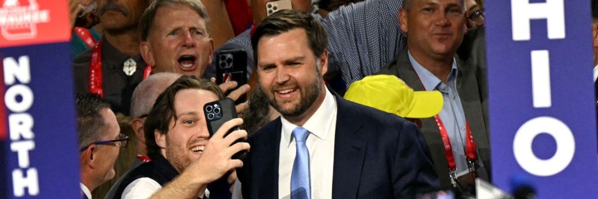 James Vance poses for a selfie with a supporter at the RNC