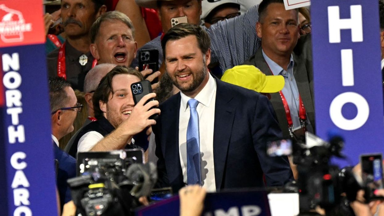 James Vance poses for a selfie with a supporter at the RNC
