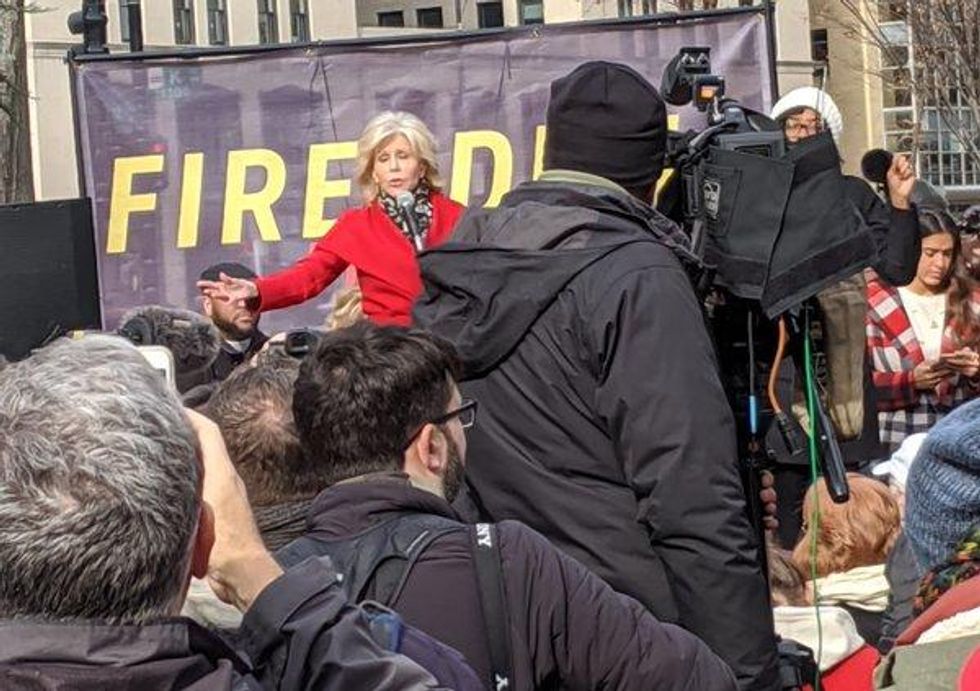 Jane Fonda addresses crowd about the connection between climate change and immigration a few blocks from the White House, photo by Jason Miller.jpg