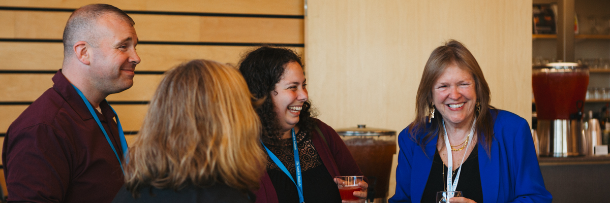 Jane O'Meara Sanders (right) speaks with attendees of the Sanders Institute Gathering