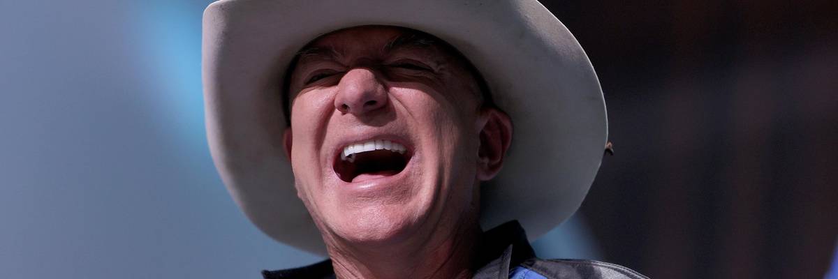 Jeff Bezos laughs
