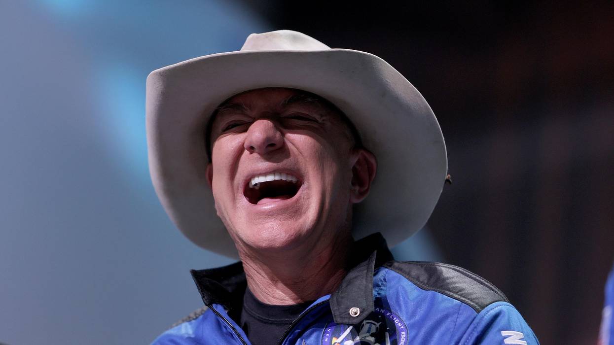 Jeff Bezos laughs