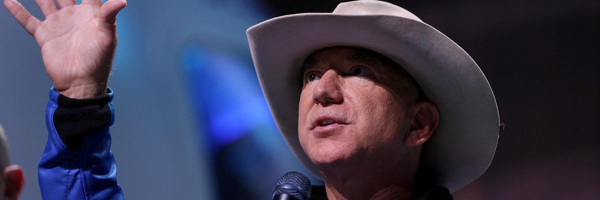 Jeff Bezos speaks to the media