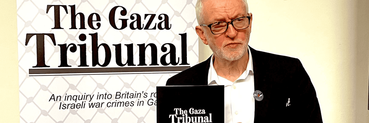 Jeremy Corbyn holds a copy of the Gaza Tribunal Report