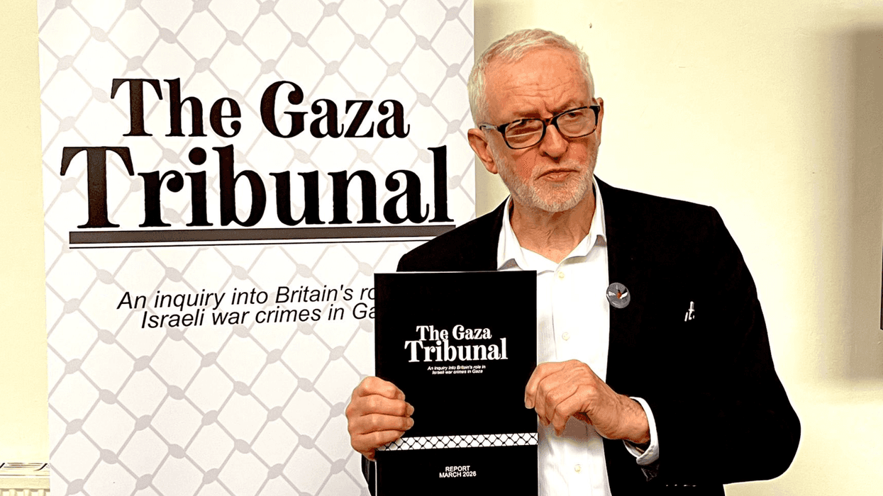 Jeremy Corbyn holds a copy of the Gaza Tribunal Report
