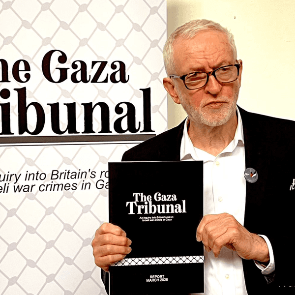 Jeremy Corbyn holds a copy of the Gaza Tribunal Report