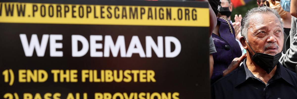 Jesse Jackson attends a voting rights rally