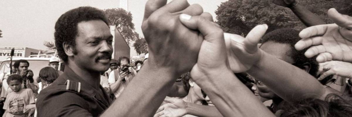 Jesse Jackson shakes hands with people in August 1983, on the 20th anniversary of the historic March on Washington.